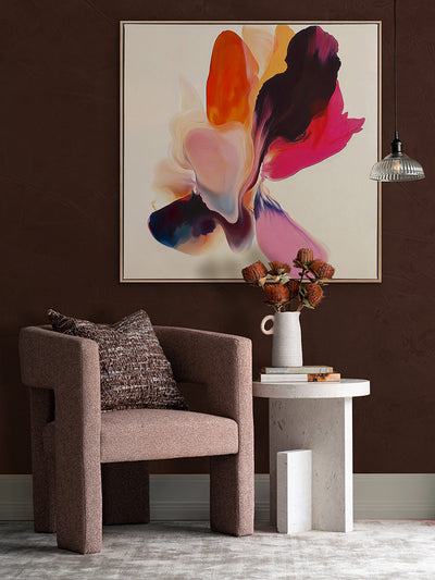 Fleeting Florals II flower artwork styled on a rich wine-toned wall above a rose armchair, with a rug and ceramic side table.