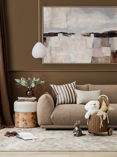 Farmland Dusk abstract landscape art print styled with dark brown accents, neutral decor, grey rug and kids toys.