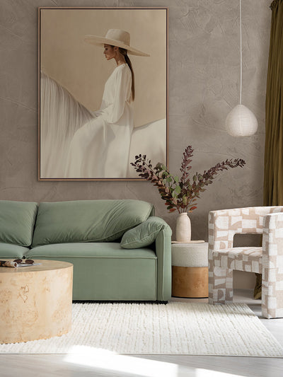 Texas Hold ‘Em portrait art hanging in a modern living room with sage green lounge, white rug and other neutral decor.