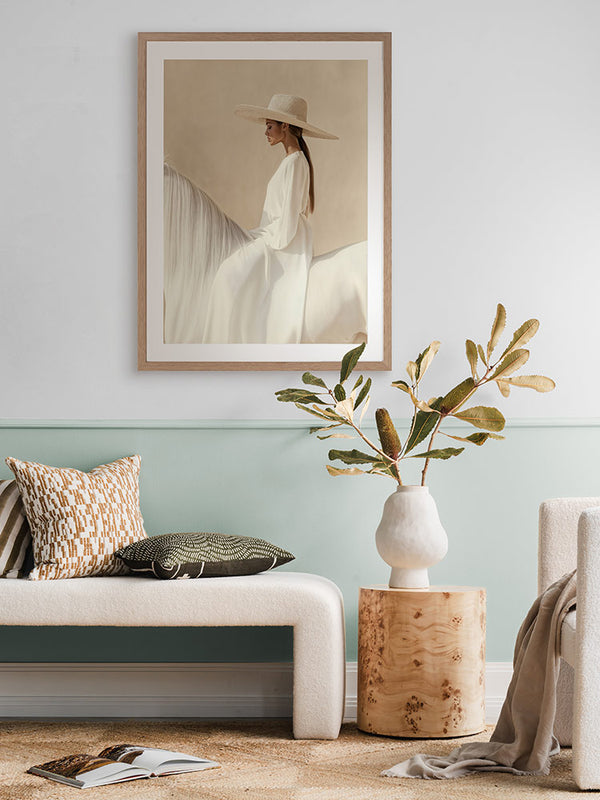 Texas Hold ‘Em portrait art hanging in a modern living room with sage green lounge, white rug and other neutral decor.