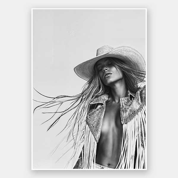 Monochrome photographic portrait artwork featuring a woman wearing a fringe jacket and cowboy hat, expressing bold freedom.