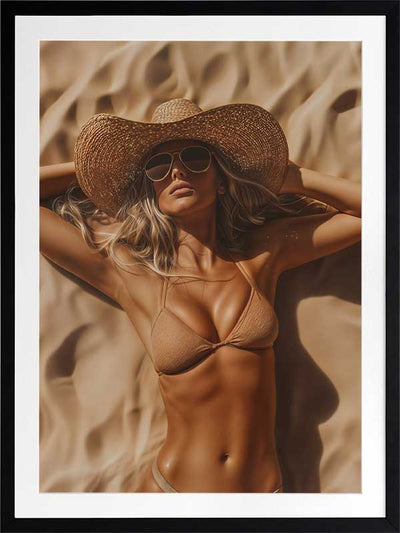 Photographic portrait art depicting a woman relaxing on the beach in golden sandy tones, perfect for coastal interiors.