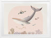 A large illustrated whale and a small turtle swim side by side through soft coral and ocean life in pastel pink and grey tones, from the Little Tails Collection by Urban Road.