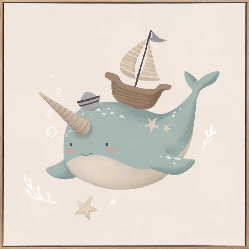 A cheerful blue narwhal wearing a captain’s hat with a tiny boat and bubbles around, in soft neutral tones, from the Little Tails Collection by Urban Road.