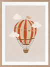 An orange hot air balloon drifts among soft clouds in a whimsical neutral scene, from the Little Tails Collection by Urban Road.