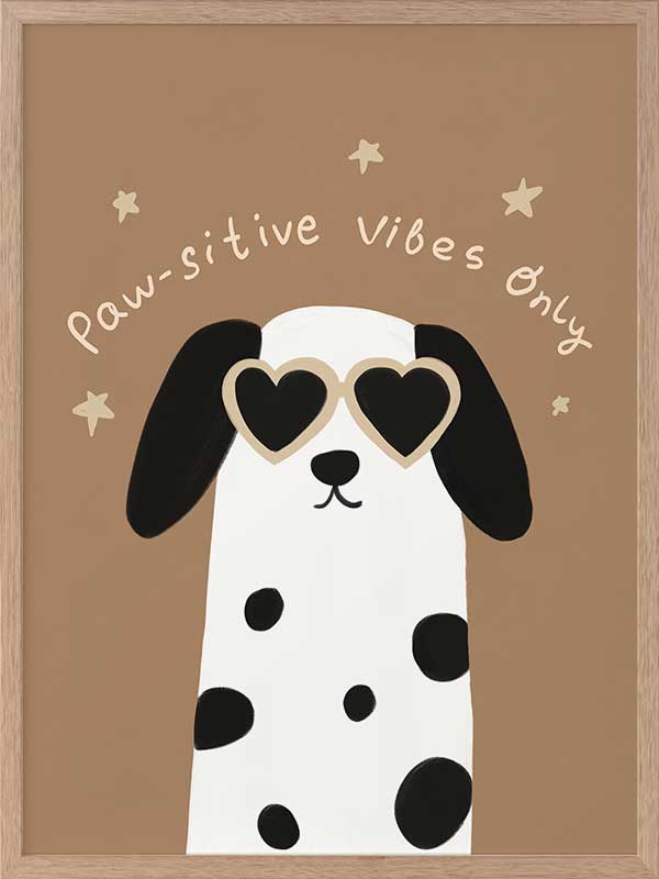 Smiling dalmatian pup with heart sunglasses and a “pawsitive vibes only” slogan on a warm brown background, from the Little Tails Collection by Urban Road.