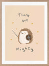 A tiny hedgehog holding a little sword and shield with scattered stars and the phrase “tiny but mighty” in warm neutral browns, from the Little Tails Collection by Urban Road.