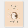 A tiny hedgehog holding a little sword and shield with scattered stars and the phrase “tiny but mighty” in warm neutral browns, from the Little Tails Collection by Urban Road.