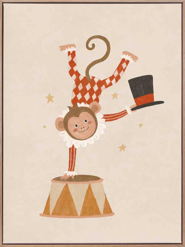 An acrobatic monkey does a handstand on a circus pedestal with a floating top hat and confetti, in neutral red accents, from the Little Tails Collection by Urban Road.