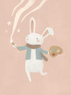 A white bunny holds a paintbrush and palette, sweeping playful painted swirls and star shapes across a pastel pink backdrop, from the Little Tails Collection by Urban Road.