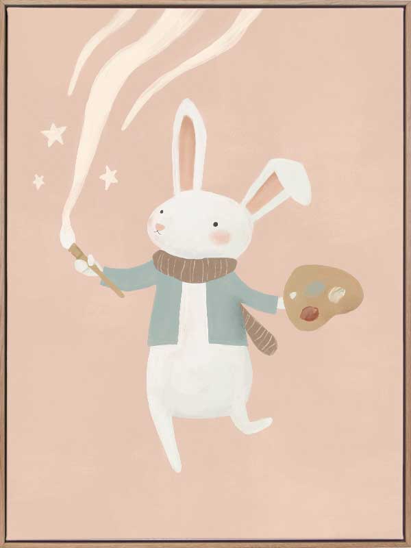 A white bunny holds a paintbrush and palette, sweeping playful painted swirls and star shapes across a pastel pink backdrop, from the Little Tails Collection by Urban Road.