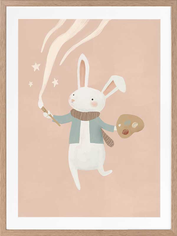 A white bunny holds a paintbrush and palette, sweeping playful painted swirls and star shapes across a pastel pink backdrop, from the Little Tails Collection by Urban Road.