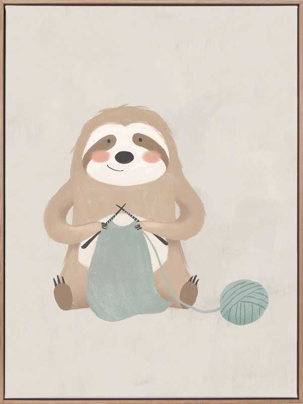 A relaxed sloth sits knitting with a ball of yarn in soft grey-brown tones, from the Little Tails Collection by Urban Road.