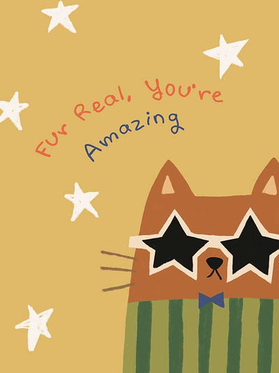 Cheeky cat in star sunglasses with the message “Fur real, you’re amazing” on a sunny yellow ground, from the Little Tails Collection by Urban Road.