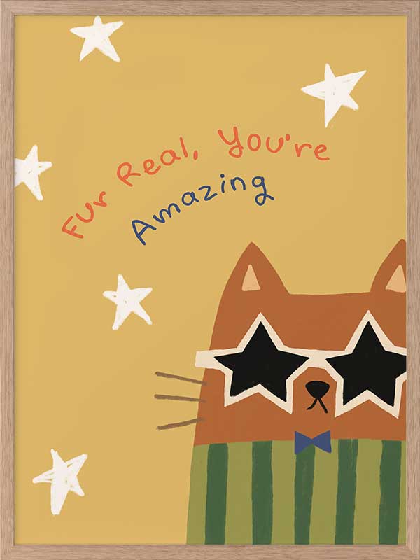 Cheeky cat in star sunglasses with the message “Fur real, you’re amazing” on a sunny yellow ground, from the Little Tails Collection by Urban Road.