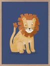 Friendly lion with a shaggy mane sits on a deep blue background, from the Little Tails Collection by Urban Road.