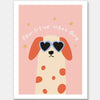 Smiling spotted dog with heart sunglasses under the phrase “Pawsitive Vibes Only” on a pink background, from the Little Tails Collection by Urban Road.