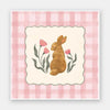 Brown bunny framed by pink gingham and tiny flowers in a soft spring palette, from the Little Tails Collection by Urban Road.