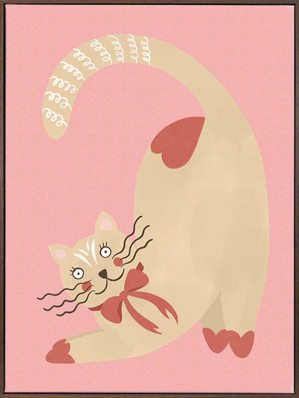 A curious cream cat with a red bow stretches on a blush-pink background in a charming storybook style, from the Little Tails Collection by Urban Road.