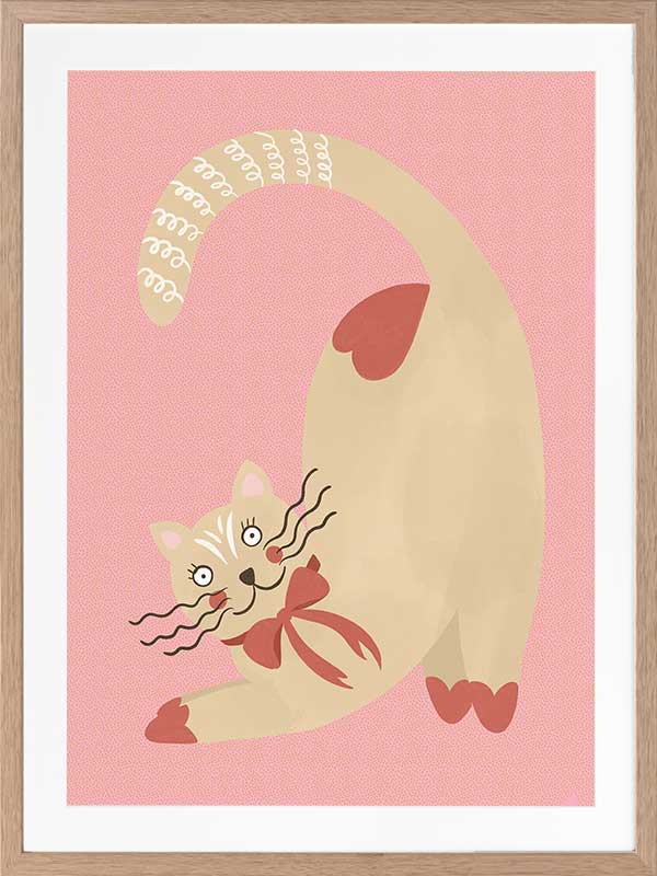 A curious cream cat with a red bow stretches on a blush-pink background in a charming storybook style, from the Little Tails Collection by Urban Road.
