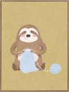 A smiling sloth knitting a blue scarf on a warm olive-gold background, from the Little Tails collection by Urban Road.