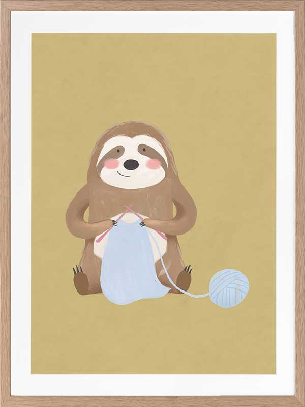 A smiling sloth knitting a blue scarf on a warm olive-gold background, from the Little Tails collection by Urban Road.