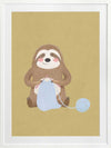 A smiling sloth knitting a blue scarf on a warm olive-gold background, from the Little Tails collection by Urban Road.