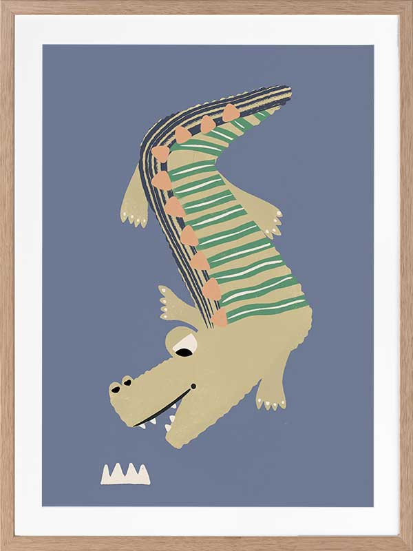A cheerful crocodile in striped pyjamas floating on a blue background, from the Little Tails collection by Urban Road.