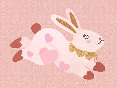 A leaping pink bunny sprinkled with heart patches on a textured blush ground, from the Little Tails collection by Urban Road.