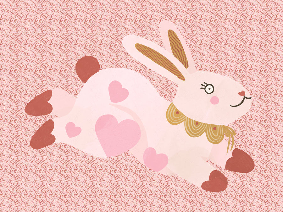 A leaping pink bunny sprinkled with heart patches on a textured blush ground, from the Little Tails collection by Urban Road.