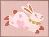 A leaping pink bunny sprinkled with heart patches on a textured blush ground, from the Little Tails collection by Urban Road.