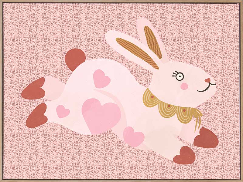 A leaping pink bunny sprinkled with heart patches on a textured blush ground, from the Little Tails collection by Urban Road.