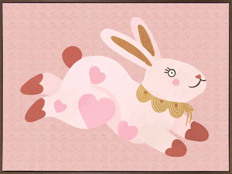 A leaping pink bunny sprinkled with heart patches on a textured blush ground, from the Little Tails collection by Urban Road.
