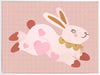 A leaping pink bunny sprinkled with heart patches on a textured blush ground, from the Little Tails collection by Urban Road.