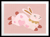 A leaping pink bunny sprinkled with heart patches on a textured blush ground, from the Little Tails collection by Urban Road.
