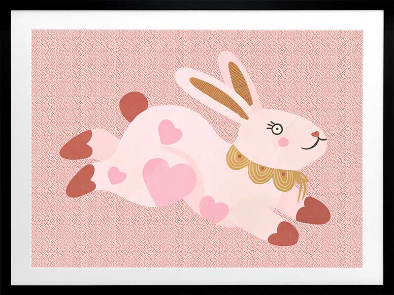 A leaping pink bunny sprinkled with heart patches on a textured blush ground, from the Little Tails collection by Urban Road.