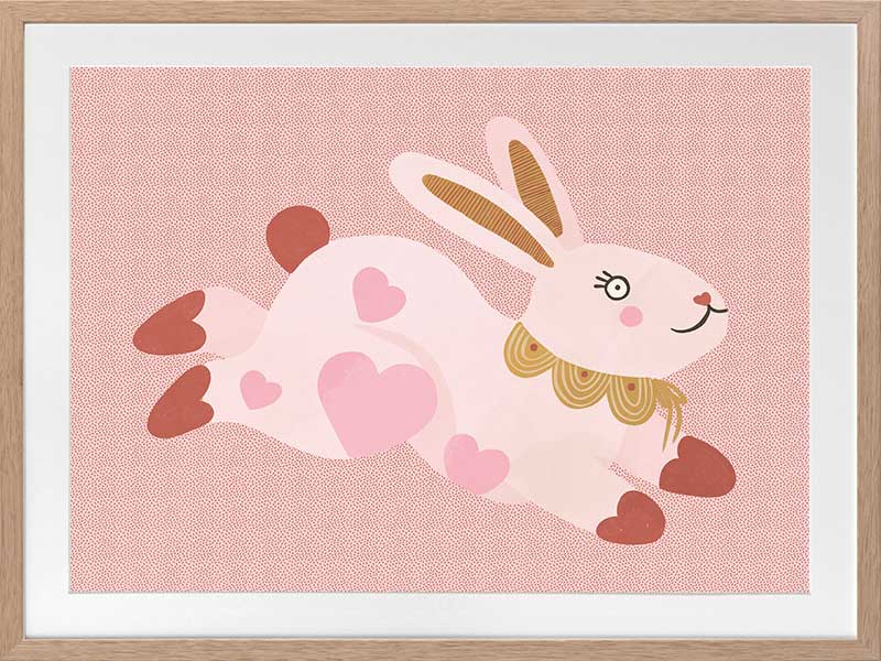 A leaping pink bunny sprinkled with heart patches on a textured blush ground, from the Little Tails collection by Urban Road.