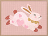 A leaping pink bunny sprinkled with heart patches on a textured blush ground, from the Little Tails collection by Urban Road.