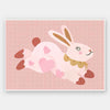 A leaping pink bunny sprinkled with heart patches on a textured blush ground, from the Little Tails collection by Urban Road.