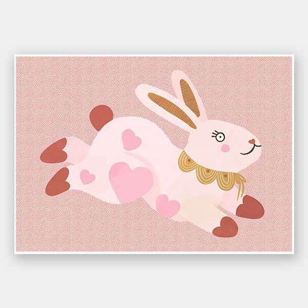A leaping pink bunny sprinkled with heart patches on a textured blush ground, from the Little Tails collection by Urban Road.