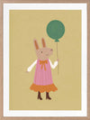 Rabbit in a pink striped dress holding a green balloon on a warm gold backdrop with pink accents, from the Little Tails Collection by Urban Road.