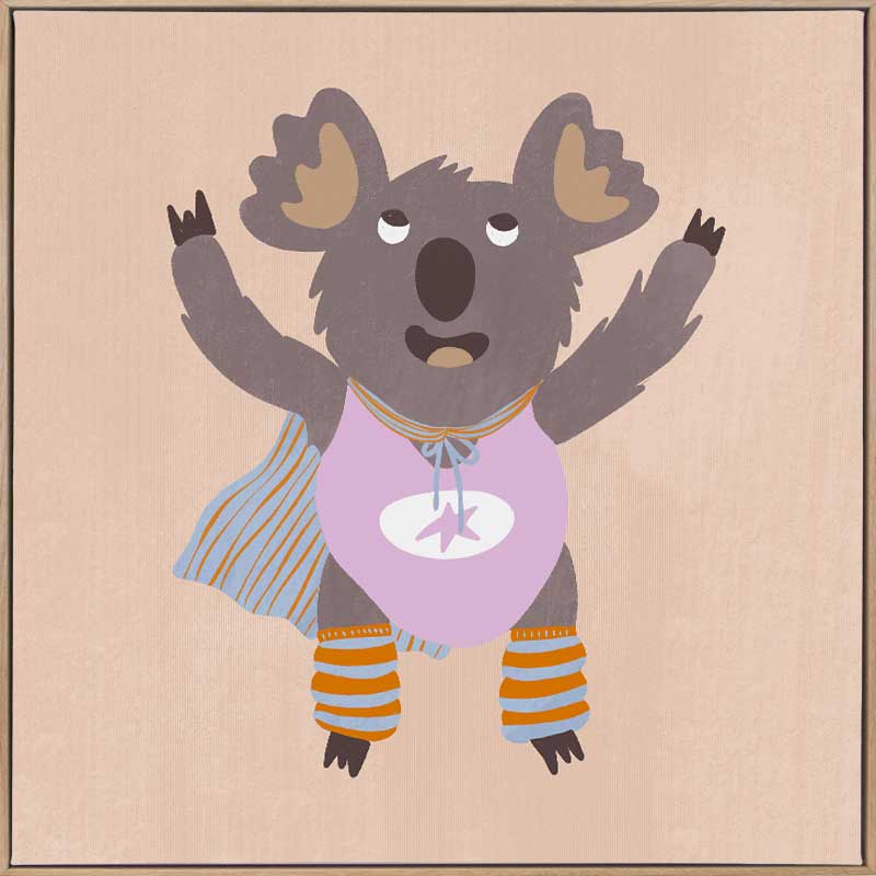 Cheerful koala in a lilac superhero outfit with a cape and striped leggings on warm beige, from the Little Tails Collection by Urban Road.