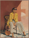 A seated woman in patterned pants and a yellow blouse leans casually against a terracotta wall. From the Lounging Ladies II collection by Urban Road.