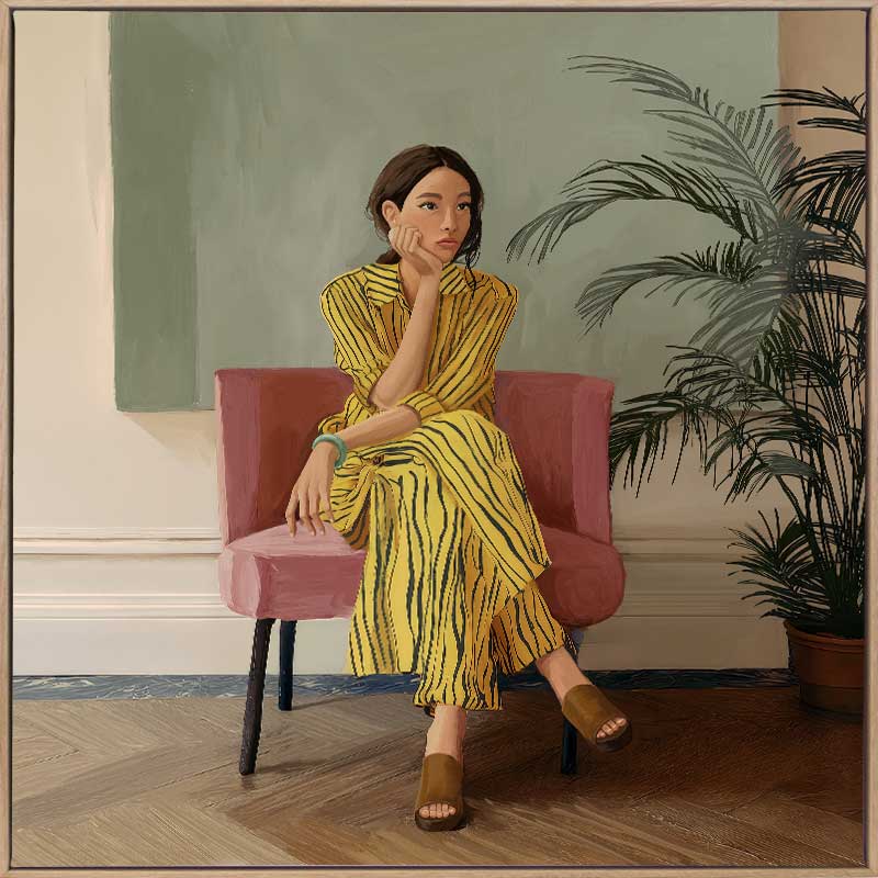 Portrait of a woman in yellow stripes sitting offline in a muted room setting, from the Lounging Ladies II collection by Urban Road.