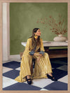 Woman in yellow-striped fashion sits poised against a green wall and patterned flooring in a moment of composed stillness, from the Lounging Ladies II collection by Urban Road.