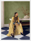 Woman in yellow-striped fashion sits poised against a green wall and patterned flooring in a moment of composed stillness, from the Lounging Ladies II collection by Urban Road.