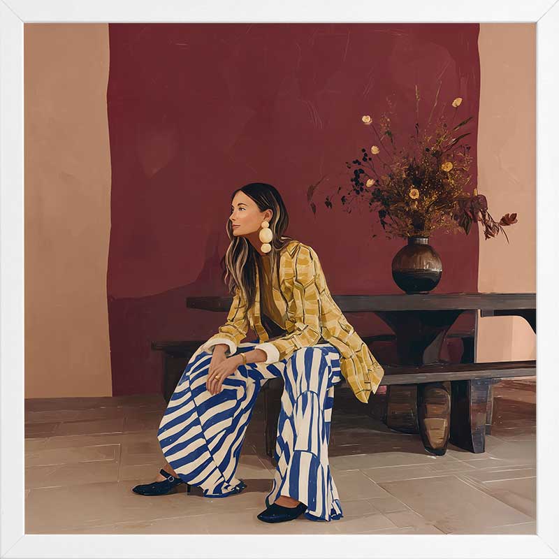 A woman in yellow seated against a moody blue and red backdrop, wearing bold striped pants, from the Lounging Ladies II collection by Urban Road.