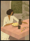 A woman sits beside a plate of lemons on a soft pink tiled table in a quiet interior. From the Lounging Ladies II collection by Urban Road.