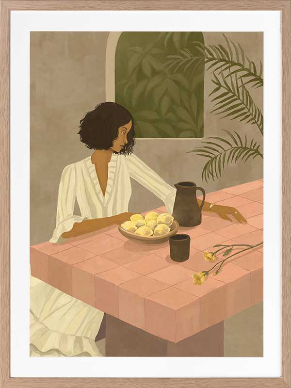 A woman sits beside a plate of lemons on a soft pink tiled table in a quiet interior. From the Lounging Ladies II collection by Urban Road.