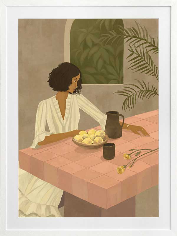 A woman sits beside a plate of lemons on a soft pink tiled table in a quiet interior. From the Lounging Ladies II collection by Urban Road.